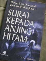 Tapa de Surat kepada anjing hitam